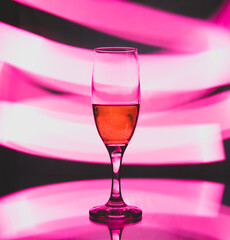 glass glass with champagne on a multicolored background
