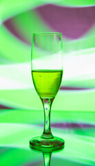 glass glass with champagne on a multicolored background