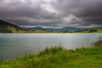 Dam surrounded by hilly countryside