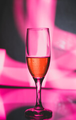 glass glass with champagne on a multicolored background