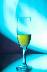 glass glass with champagne on a multicolored background