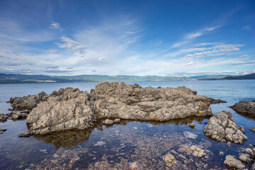 Fototapeta na wymiar Cliffs in the shallow sea on Krk, Croatia 
