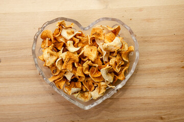 dried apple in a heart shape vase