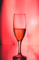 glass glass with champagne on a multicolored background
