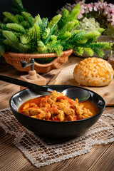 Chicken fricassee with red paprika and onion.