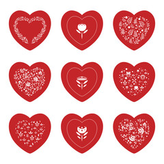 Collection of red hearts with white tracery on white background. St Valentines symbol.
