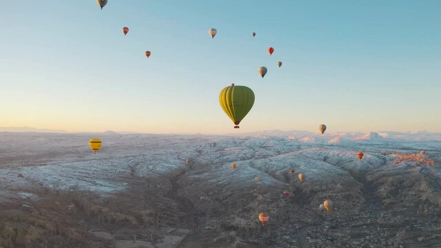 Aerial view of fairy chimneys. Flight hot air balloons in Cappadocia. 4K Footage