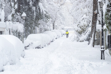 People enjoying the historical Snowtorm over Madrid city, Spain.