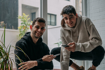 friends at home online with mobile phones