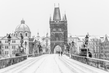 Fototapeta na wymiar Snow storm on Charles Bridge in Prague
