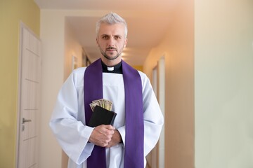 The priest walks around the houses of the faithful. Collecting money during pastoral visits.