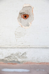 Old wall with a hole from the pipe. Background vertical image