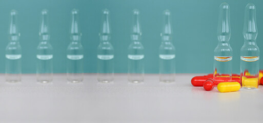 medicine bottles and colored capsules