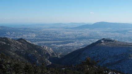 Fototapeta premium Breathtaking scenic view to whole Athens - Attica from snowed peak of Parnitha mountain, Greece