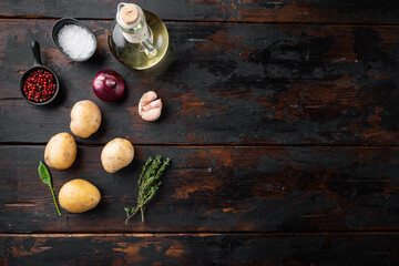 Fototapeta na wymiar Fresh Pile of potatoes, on old dark wooden table background, top view flat lay , with space for text copyspace
