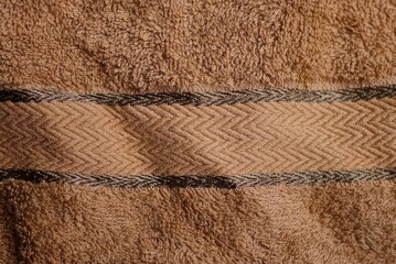 brown texture from a piece of woolen cloth with a stripe