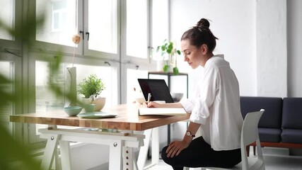 Young adult female professional working in a modern office
- Powered by Adobe