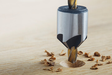 Countersink drill bit make sink in hole for screw in wooden oak plank