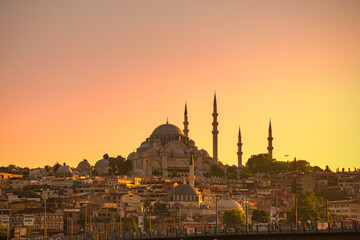 Fototapeta na wymiar Istanbul / Turkey- 3 July 2018: Evening view of Suleymaniye Mosque and Galata bridge