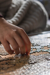 girl assembling a puzzle