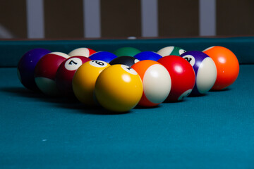 billiard balls on a green table