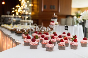 Strawberry cupcakes and wedding cake and treats