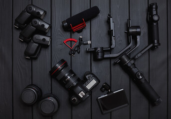 set of professional video and photo dslr camera equipment with motorized gimbal stabilizer and...