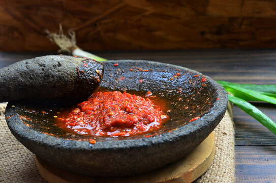 sambal tomat ulek or tomato sauce grind, traditional food from indonesia made from tomato chilli onion and gralic