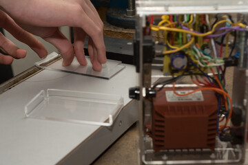 Technicians Bends Acrylic Glass Panel For Electronics