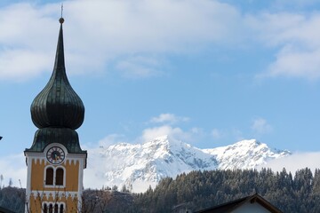 Schladming Church Spire With Dachstein Mountains In The Background