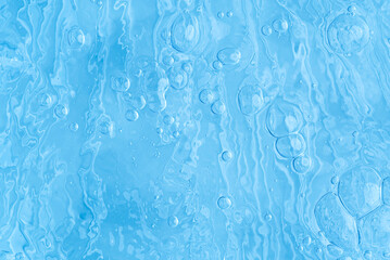 blue transparent clean drinking water abstract background. water surface with air bubbles background