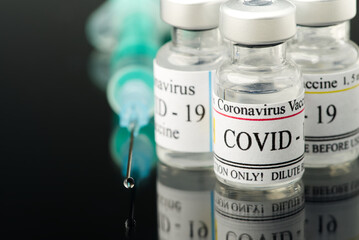 Covid-19 vaccine concept. vaccine in small glass ampoules