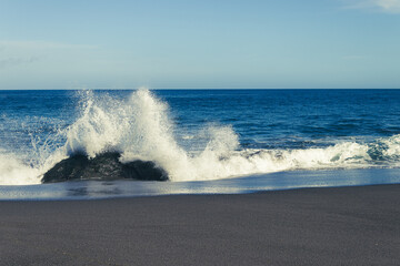 Fototapeta premium Atlantic ocean, strong waves, splashing, breaking on coast, rocks, volcanic island, Azores.