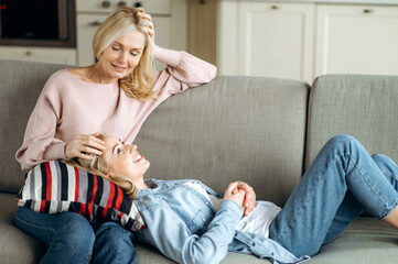 Senior caucasian blinde mother and her beloved young adult daughter spend time together on the...
