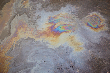 Beautiful abstract colorful background, texture:, stains from engine oil on the asphalt