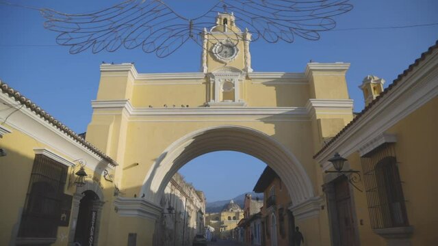 Arch of Santa Catalina in Antigua Guatemala with blue sky in the background early in the morning - emblematic square in Antigua Guatemala 