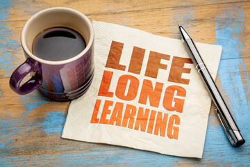 lifelong learning concept -  word abstract on a napkin with a cup of espresso coffee, education,...
