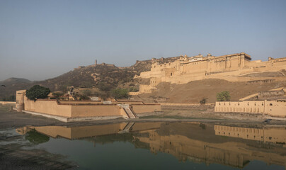 On the crest of a rocky hill is the fortified residence of Raja Man Singh I Amber Fort in the northern suburb of Jaipur of the same name. India.
