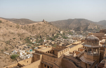 On the crest of a rocky hill is the fortified residence of Raja Man Singh I Amber Fort in the northern suburb of Jaipur of the same name. India.