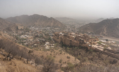 On the crest of a rocky hill is the fortified residence of Raja Man Singh I Amber Fort in the northern suburb of Jaipur of the same name. India.