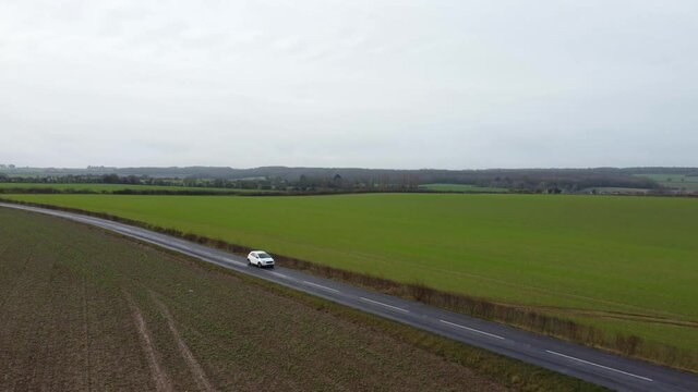 Drone coming down and following a white van on a country road in Kent on Adisham Road.
