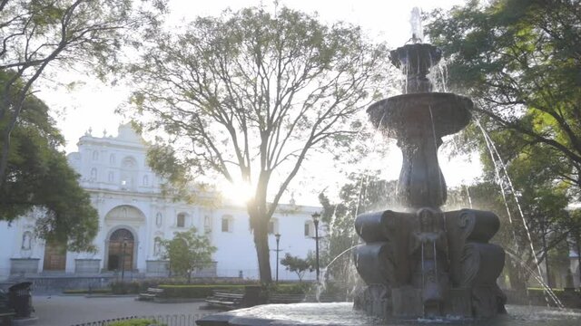 Sunrise at Sirens Fountain in the central park of Antigua Guatemala - beautiful colonial park with a fountain in Antigua Guatemala 