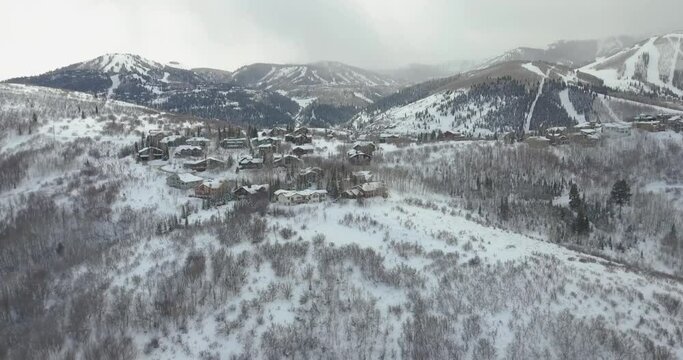 Aerial Drone View Going Up Snowy Ski Resort Mountain In Park City, Utah During Sundance Film Festival