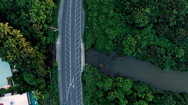 Birds eye view of bridge with ongoing traffic in small Caribbean island of Saint Lucia.