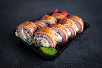 Traditional Japanese rolls with fried tuna in box