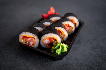 Traditional Japanese rolls with shrimp and cheese in box