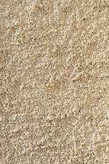 Aged bright yellow termal isolation wall texture grain rough surface low quality construction in Sofia, Bulgaria, Eastern Europe