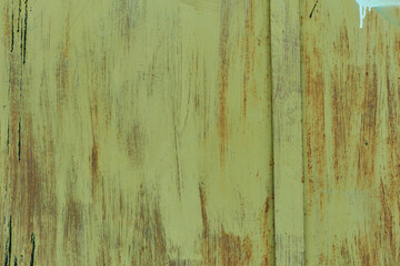 Plate of metal rusty texture with traces of green paint faint color corroded with age in Sofia,...