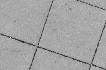 White stone floor texture seamless background top view of sidewalk tiles