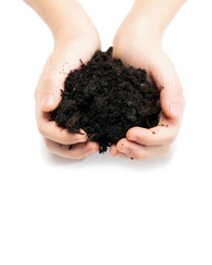 kids hands holding in palms of fertile soil on white background